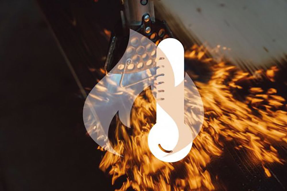 Thermal imaging of a metal welding process with sparks and flames.