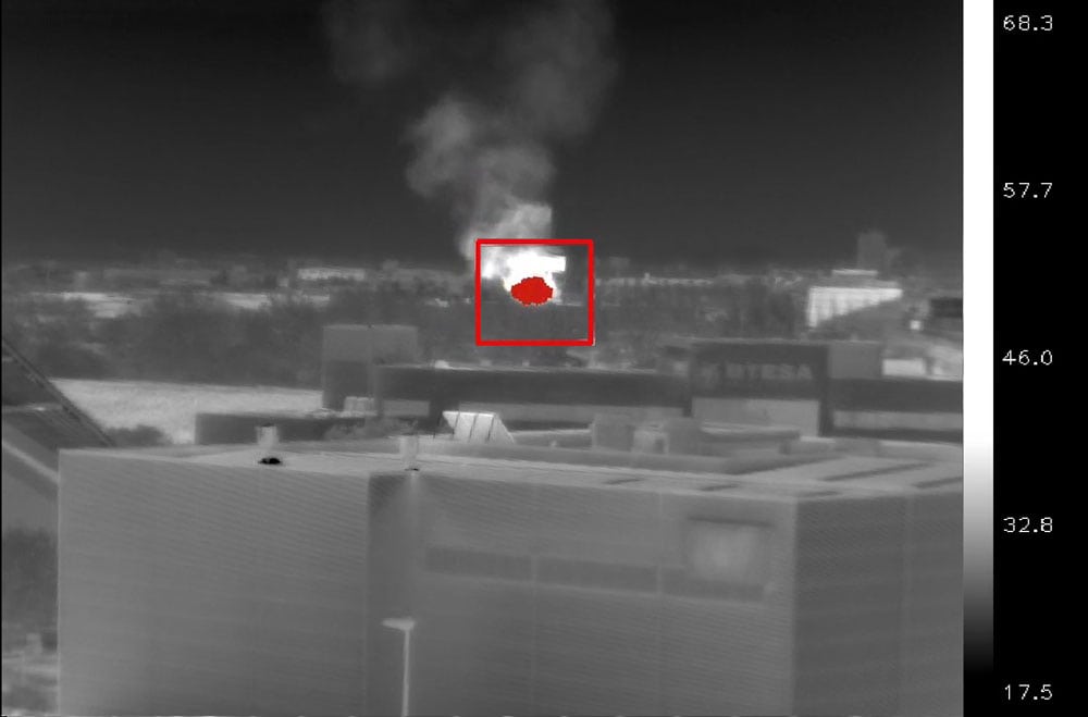 Infrared thermal image showing flame detection for fire safety monitoring.