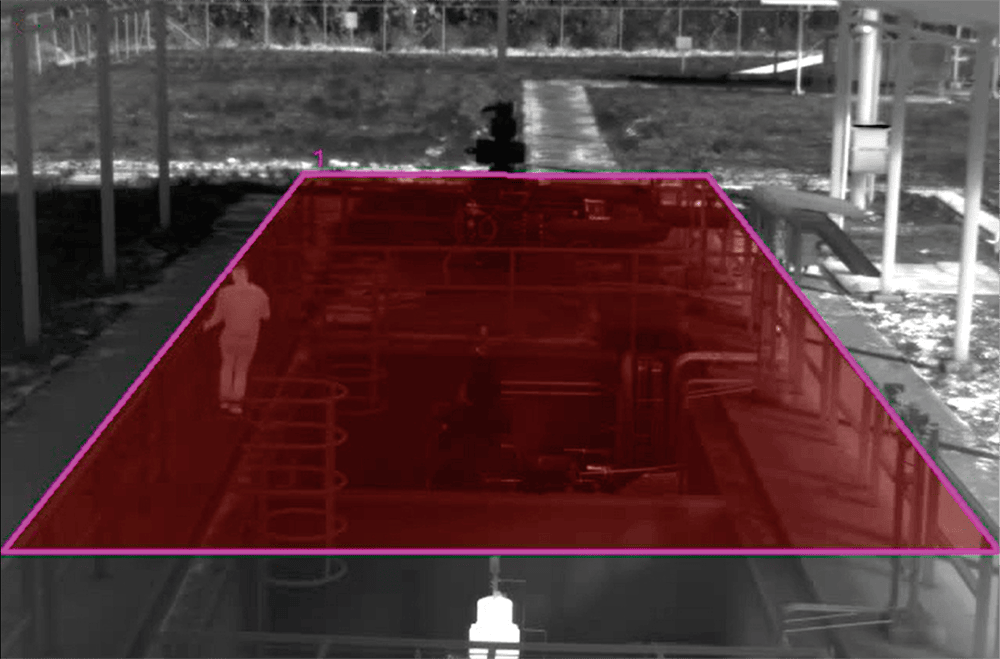 Surveillance camera monitoring a restricted zone for security and safety.