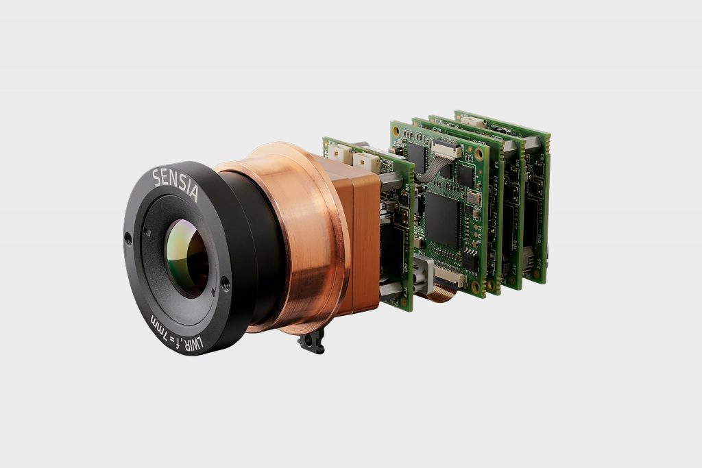 Advanced defense and security camera with integrated circuit boards and sensor lens.